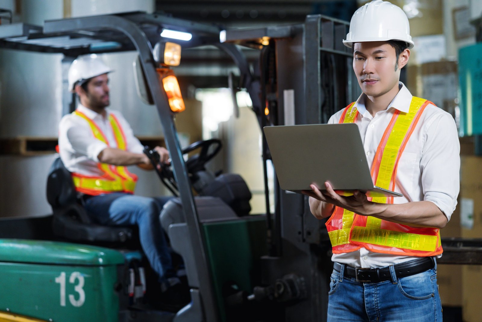 engineer staff male warehouse worker in hard hat working. walking through logistics center warehouse factory construction site logistics architect forklife driver man builder indoors background